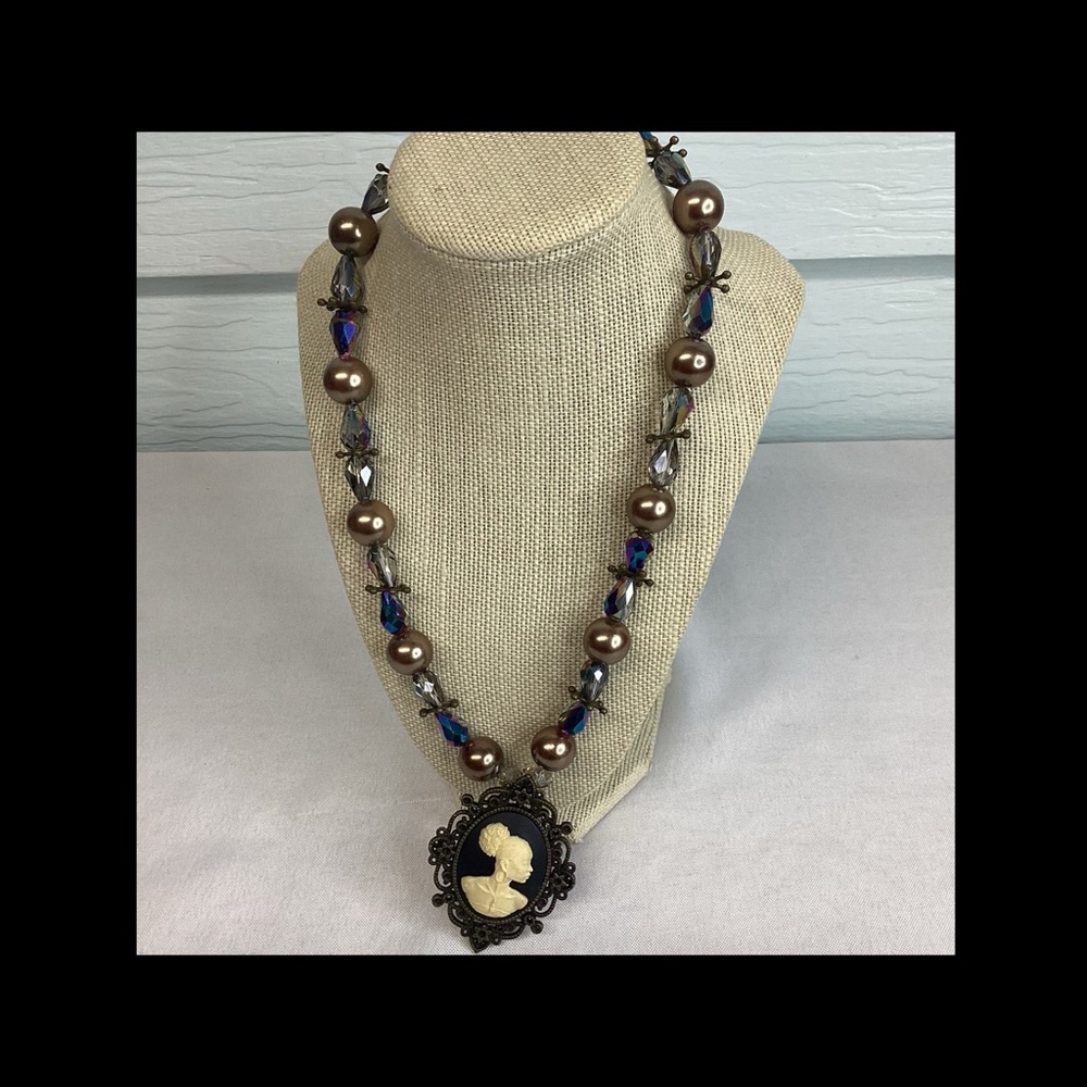 Black and white cameo necklace.